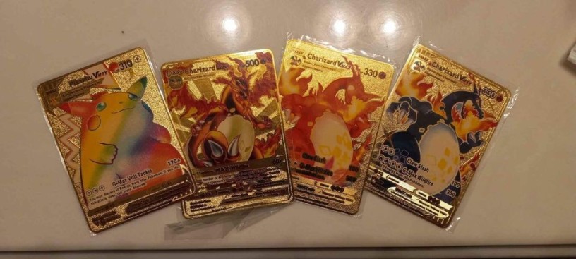 4-cards-of-pokemon-3-of-them-charizard-and-pikachu-big-0